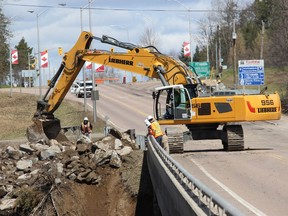 Efforts to construct a man-made peninsula to buffer the north-side abutment of the Petawawa River Bridge on Petawawa Boulevard continued throughout the day on Tuesday, April 30. It was discovered early Tuesday morning that the swollen, fast flowing flood waters of the Petawawa River were eroding the abutment leading officials to close the bridge indefinitely for safety and reroute traffic to and from Garrison Petawawa to the Highway 17 bridge.