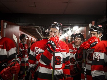 Ottawa 67's Alec Belanger keeps a close eye on the Guelph Storm players as they head to the ice after the second period intermission at TD Place Arena on Saturday.