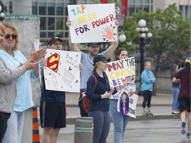Supporters cheer on runners during the marathon at the Ottawa Race Weekend on Sunday, May 26, 2019.