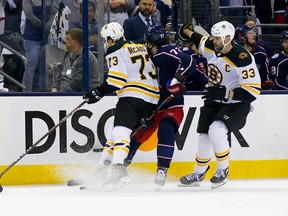 Bruins’ Charlie McAvoy checks Blue Jackets’ Josh Anderson in the head during Game 6 of their series on Monday. McAvoy was suspended one game for the hit.  Getty Images