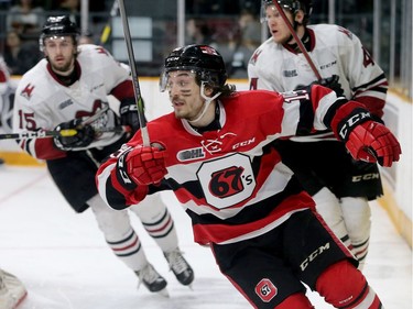 Ottawa's Kyle Maksimovich races for the puck behind Geulph's net during first-period action of the Ottawa 67's matchup against the Guelph Storm in game five of the Eastern OHL final at TD Place in Ottawa Friday.