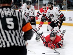 Ottawa's Marco Rossi swings at the puck after getting knocked down during first period action of the Ottawa 67's matchup against the Guelph Storm in game five of the Eastern OHL final at TD Place in Ottawa Friday (May 10, 2019). Julie Oliver/Postmedia