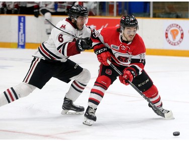 Ottawa's Kyle Maksimovich gets the puck away from Geulph's Sean Durzi for a run down the ice during the Ottawa 67's matchup against the Guelph Storm in game five of the Eastern OHL final at TD Place in Ottawa on Friday.