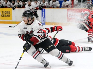 Guelph's Jack Hanley leaves players on the ice as he takes control of the puck during the first period. Guelph was on top 2-1 going into the second period during the Ottawa 67's matchup against the Guelph Storm in game five of the Eastern OHL final at TD Place in Ottawa Friday .