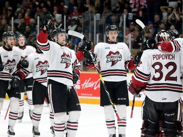 The Guelph Storm congratulate their goalie, Anthony Popovich for holding off the Ottawa 67's, who fell 4-3 to the Storm during their matchup in game five of the Eastern OHL final at TD Place in Ottawa on Friday.