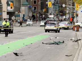Ottawa police block off the area where a cyclist was struck on Laurier Avenue near Elgin Street on Thursday, May 16, 2019.
