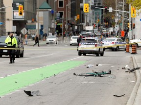 Ottawa Police block off the area where a cyclist was struck on Laurier Avenue near Elgin Street Thursday (May 16, 2019) morning. The driver of the vehicle that has left the cyclist with critical head injuries kept going and then abandoned the vehicle.  Julie Oliver/Postmedia