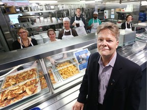 Peter Tilley, CEO of The Mission stands with volunteers as they get ready for the 3 p.m. meal on May 28, 2019.