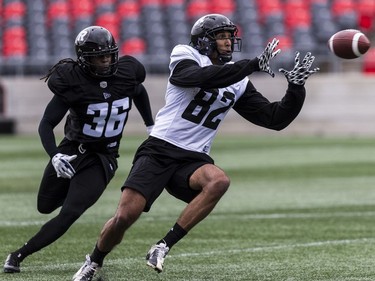 WR Wesley Lewis makes a catch and eludes the tackle of LB Deshawntee Gallon during Ottawa Redblacks rookie camp at TD Place on Wednesday, May 15, 2019. Errol McGihon/Postmedia