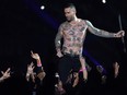 Lead vocalist of Maroon 5 Adam Levine performs during the halftime show of Super Bowl LIII between the New England Patriots and the Los Angeles Rams at Mercedes-Benz Stadium in Atlanta, Georgia, on February 3, 2019. (TIMOTHY A. CLARY/AFP/Getty Images)