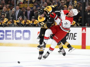 Bruins forward David Backes (left) checks Lucas Wallmark  of the Carolina Hurricanes during their Eastern Conference final. Boston swept the series 4-0. (Bruce Bennett/Getty Images)
