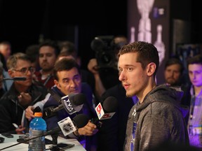 St. Louis Blues goaltender Jordan Binnington draws a crowd at media day in Boston on Sunday. (Bruce Bennett/Getty Images)