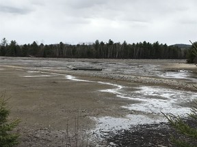 Pembroke area resident Dave Smyth is upset at low-water levels on the Ottawa River near Rapides-des-Joachims, while his cottage at Allumettes Island is nearly underwater. Photo was taken near the hamlet of Bissett Creek on Monday.