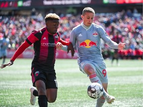 Forward Christiano François battles New York Red Bulls II Rece Buckmaster