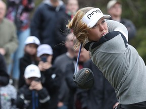 LPGA Tour star Brooke Henderson hits some balls during a demonstration for kids at the Eagle Creek Golf Club in Dunrobin, Ont., on Tuesday. Henderson was attending the Kevin Haime Kids to the Course Classic.