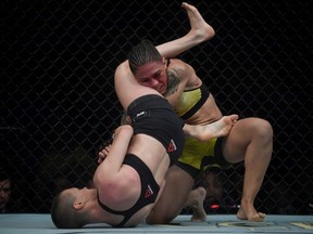 Brazilian fighter Jessica Andrade (right) competes against U.S. fighter Rose Namajunas (left) during their women's strawweight title bout at the Ultimate Fighting Championship event at Jeunesse Arena in Rio de Janeiro on Saturday, May 11, 2019.