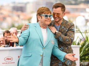 Elton John (L) and Taron Egerton attend the photocall for "Rocketman" during the 72nd annual Cannes Film Festival in Cannes, France, on May 16, 2019.