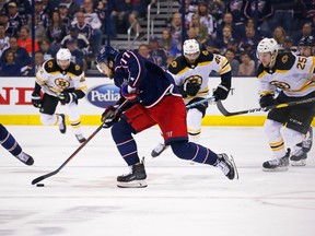 Blue Jackets’ Josh Anderson carries the puck as Bruins players give chase. Anderson, 6-foot-3 and 221 pounds, has been compared to Capitals bruiser Tom Wilson. (GETTY IMAGES)