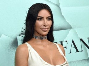 This Oct. 9, 2018 file photo shows Kim Kardashian West at the Tiffany & Co. 2018 Blue Book Collection: The Four Seasons of Tiffany celebration in New York. Oxygen Media said Tuesday, May 7, 2019, that it has greenlighted a two-hour documentary that will capture Kardashian West's efforts to free prisoners she believes were wrongly accused of crimes.(Photo by Evan Agostini/Invision/AP, File) ORG XMIT: NYET333