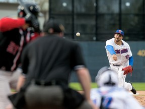 Champions starter Phillippe Aumont delivers during last night’s season-opener against the New Jersey Jackals at RCGT Park on Friday night. (WAYNE CUDDINGTON/POSTMEDIA NETWORK)