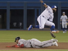 Blue Jays second baseman Richard Urena can't put the tag on Red Sox baserunner Rafael Devers who is safe stealing second base in the first inning during MLB action in Toronto, Monday, May 20, 2019.