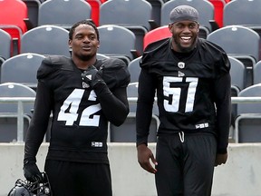 Linebacker Shaheed Salmon (51) shares a laugh with linebacker Avery Williams during Ottawa Redblacks training camp at TD Place on Wednesday, May 29, 2019. Julie Oliver/Postmedia