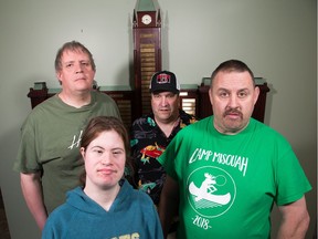 (Clockwise from lower left) Suzanne Winter-Heartson, 32, Brian Jones, 48, Scott Helman, 50, and Paul Pringle, 45, are four of 33 workers with developmental disabilities who have been told their contract shredding paper for the federal government will end next year. It's the second time the program, run by the Ottawa-Carleton Association for Persons with Developmental Disabilities, has faced elimination. Some of the workers have been employed on the job for decades.