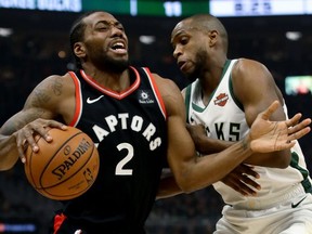 Raptors Kawhi Leonard is guarded by Bucks Khris Middletonin Game 2 of the East final. GETTY