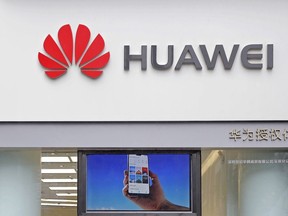 In this March 7, 2019 file photo, a logo of Huawei is displayed at a shop in Shenzhen, China's Guangdong province.