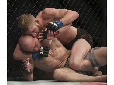 Mitch Gagnon (bottom) fights Cole Smith (top) during UFC Fight Night Bantamweight bout held at Canadian Tire Centre on Saturday.