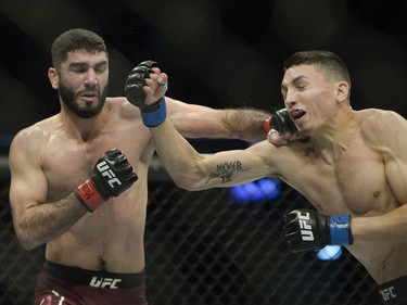 Aiemann Zahabi (left) fights Vince Morales (right) during UFC Fight Night Bantamweight bout held at Canadian Tire Centre on Saturday.