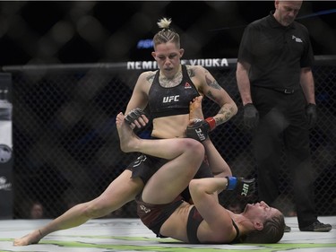 Macy Chiasson (top) fights Sarah Moras (bottom) during UFC Fight Night Women's Bantamweight bout held at Canadian Tire Centre on Saturday.