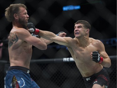 Donald Cerrone (left) fights Al Iaquinta (right) during UFC Fight Night Lightweight bout held at Canadian Tire Centre on Saturday.