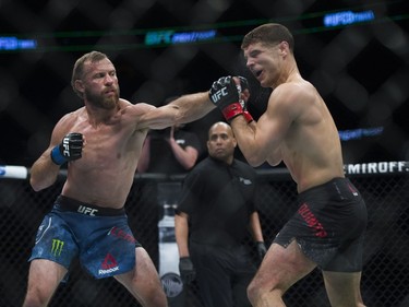 Donald Cerrone (left) fights Al Iaquinta (right) during UFC Fight Night Lightweight bout held at Canadian Tire Centre on Saturday.