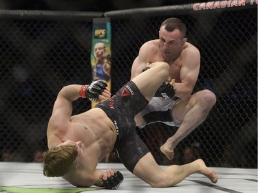 Brad Katona (left) fights Merab Dvalishvili (right) during UFC Fight Night Bantamweight bout held at Canadian Tire Centre on Saturday.