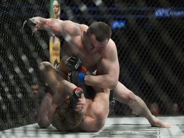 Merab Dvalishvili (top) fights Brad Katona (bottom) during UFC Fight Night Bantamweight bout held at Canadian Tire Centre on Saturday.