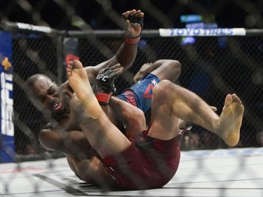 Derek Brunson drops Elias Theodorou during UFC Fight Night Middleweight bout held at Canadian Tire Centre on Saturday.