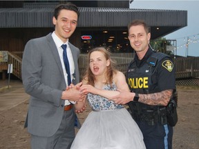 Gabby Horner-Shepherd with her two prom dates, Zack Bowman and Constable Jeremy Renton. Gabby and her mom, Shannon Horner-Shepherd, created a website and video to look for a prom date last week. (CONTRIBUTED PHOTO)