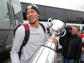 Calgary Stampeders Eric Rogers with the Grey Cup as the team returned to McMahon stadium in Calgary on Monday November 26, 2018.