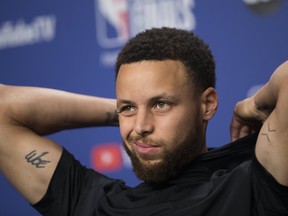 Warriors guard Stephen Curry speaks to the media on Sunday afternoon ahead of Monday's Game 5 in Toronto. (STAN BEHAL/Toronto Sun)