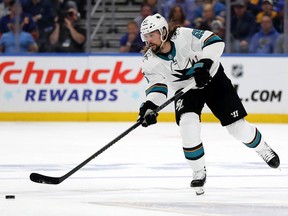Erik Karlsson of the San Jose Sharks moves the puck against the St. Louis Blues during Game 3 of the NHL’s Western Conference final series in St. Louis on May 15, 2019.