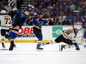 Brayden Schenn of the St. Louis Blues gets tripped up against the Boston Bruins during the first period in Game Three of the  Stanley Cup Final at Enterprise Center in St Louis on Saturday night. (Photo by Bruce Bennett/Getty Images)