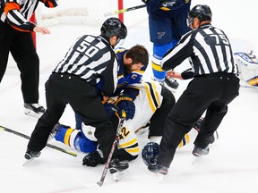 Bruins’ David Backes and Alex Pietrangelo of the Blues mix it up in Game 4.  Getty Images
