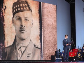 Prime Minister Justin Trudeau reads the Victoria Cross citation of Lieutenant-Colonel Cecil Merritt (in English and French) during the D-Day 75 Commemorations on June 05, 2019 in Portsmouth, England. The political heads of 16 countries involved in the Second World War joined the Queen for a service to commemorate the 75th anniversary of D-Day.