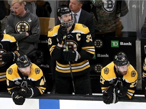 Zdeno Chara watches the action from the Bruins bench during Game 5 of the Stanley Cup final in Boston on Thursday night.