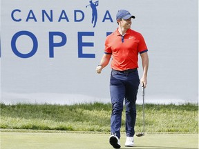 Rory McIlroy of reacts after a birdie putt on the 14th green during the final round of the RBC Canadian Open at Hamilton Golf and Country Club on Sunday.