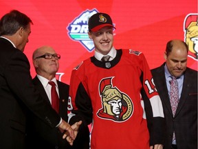 Chief amateur scout Trent Mann, right, was part of the welcoming committee after the Senators took Lassi Thomson 19th overall on Friday night.