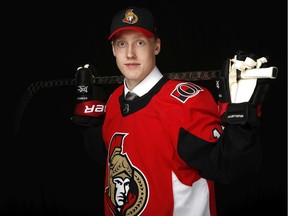 The No. 19 pick in the 2019 NHL draft, Lassi Thomson, poses in his Ottawa Senators jersey.
