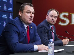 General manager Pierre Dorion, seen here with new head coach D.J. Smith during a media conference in May, says the Senators will get a player who will play in the NHL eventually with the No. 19 pick in the draft on Friday night.