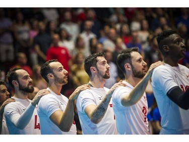 Canadian players listen to the national anthem before Sunday's match at TD Place arena.